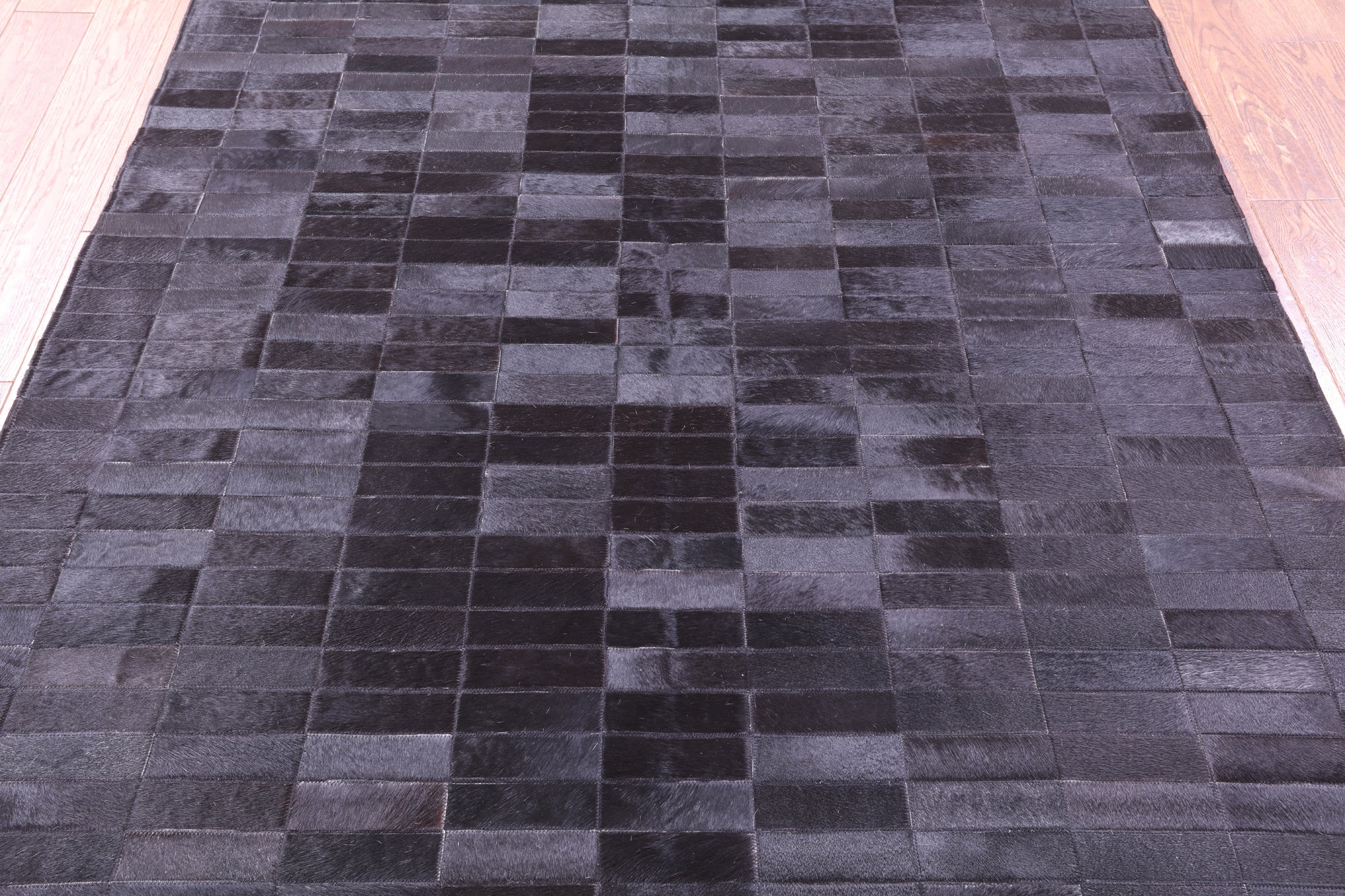 Black Brickwork Natural Cowhide Hand Stitched Patchwork Rug - 5' 3" X 6' 6" - Golden Nile
