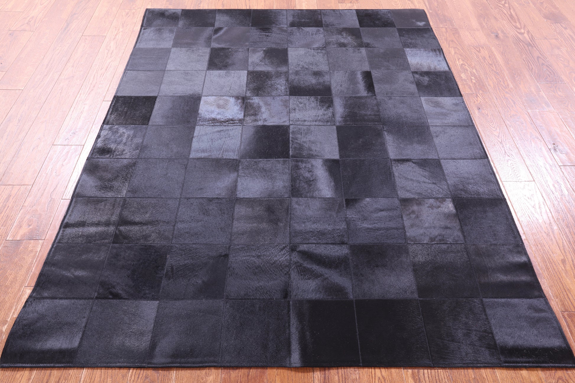 Black Natural Cowhide Hand Stitched Patchwork Rug - 5' 3" X 6' 7" - Golden Nile
