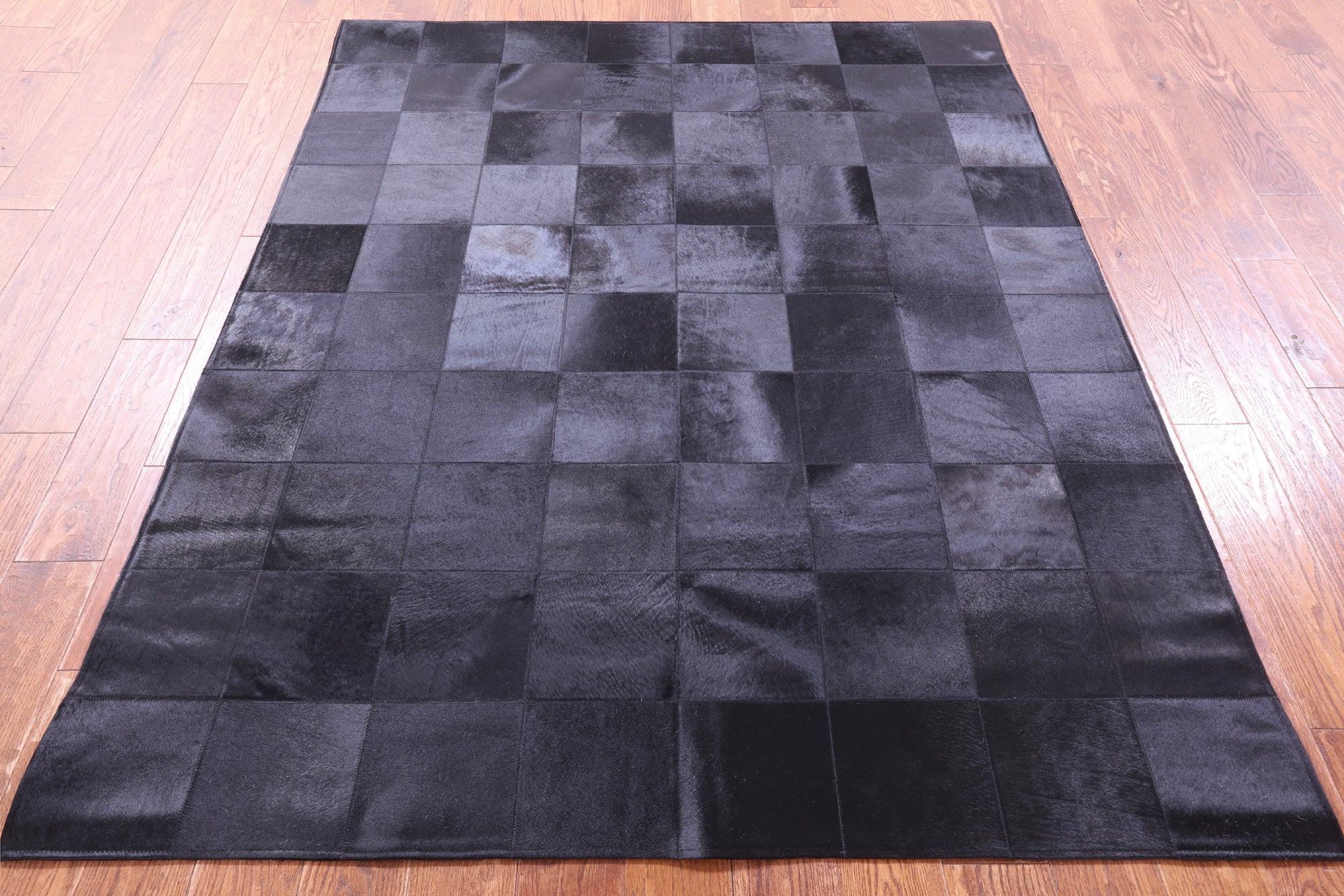 Black Natural Cowhide Hand Stitched Patchwork Rug - 5' 3" X 6' 7" - Golden Nile