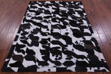 Black & White Natural Cowhide Hand Stitched Patchwork Rug - 5' 0" X 6' 7"