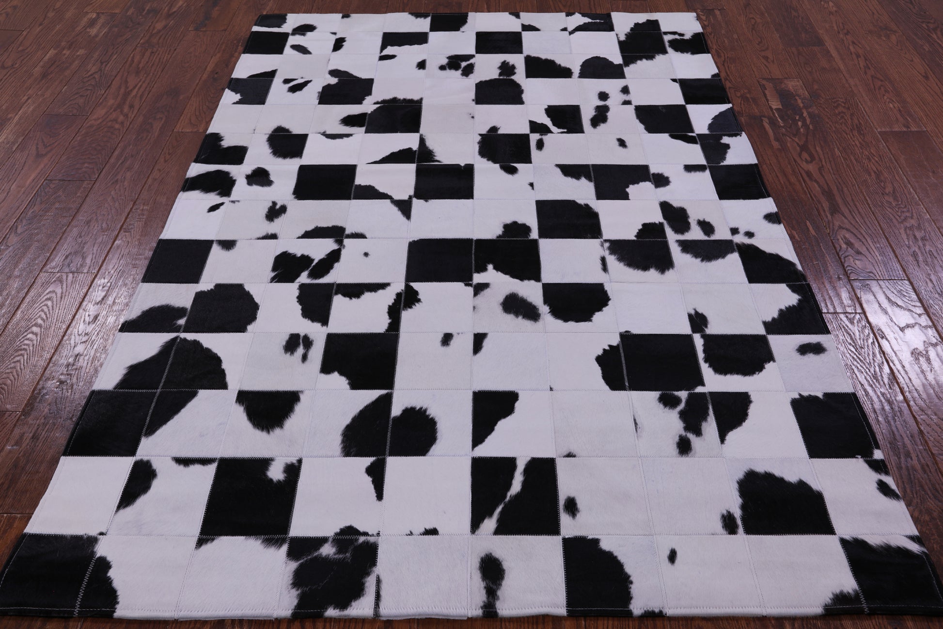 Black & White Natural Cowhide Hand Stitched Patchwork Rug - 4' 10" X 6' 9" - Golden Nile