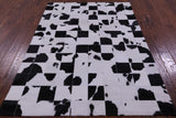 Black & White Natural Cowhide Hand Stitched Patchwork Rug - 4' 10" X 6' 9"