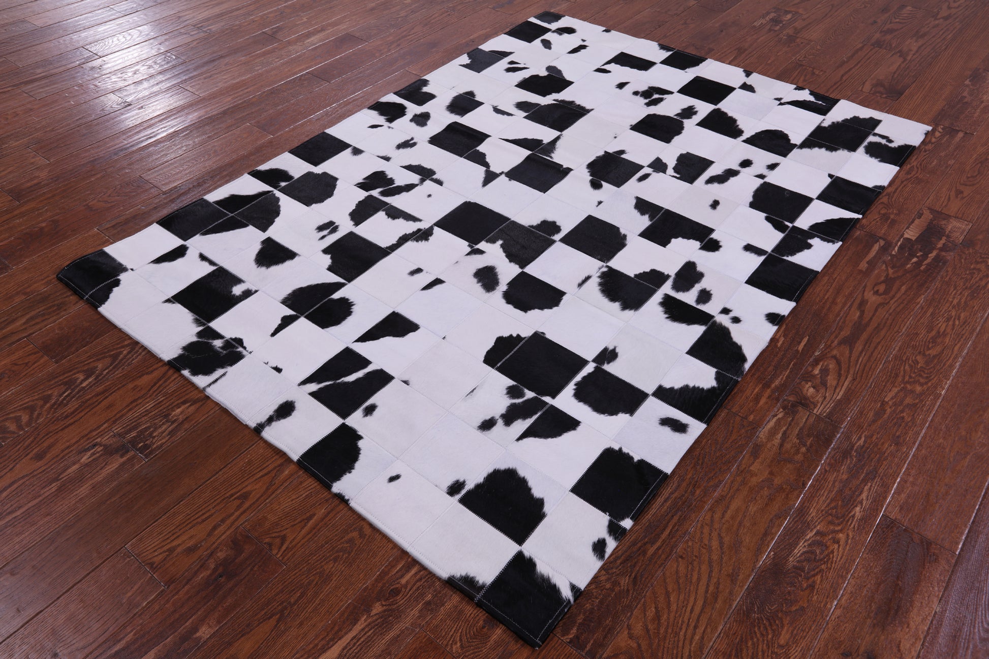 Black & White Natural Cowhide Hand Stitched Patchwork Rug - 4' 10" X 6' 9" - Golden Nile