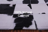 Black & White Natural Cowhide Hand Stitched Patchwork Rug - 4' 10" X 6' 9"