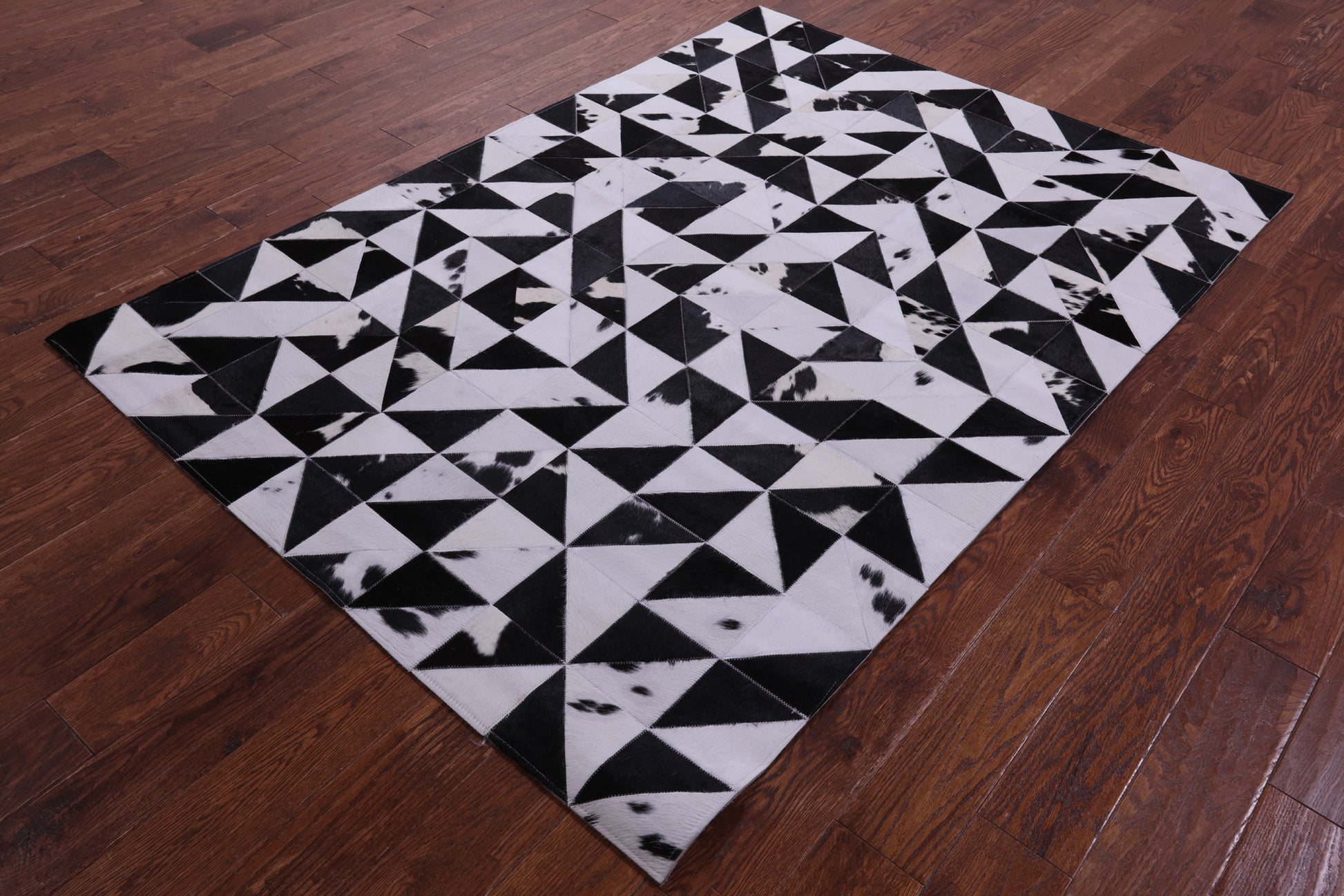 Black & White Natural Cowhide Hand Stitched Patchwork Rug - 4' 11" X 6' 10" - Golden Nile