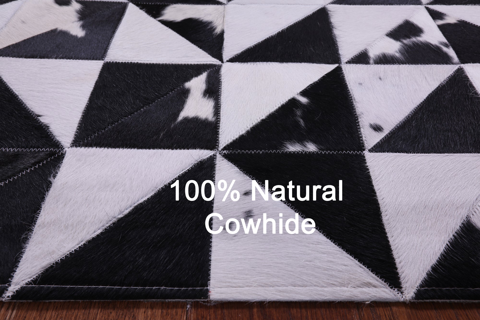 Black & White Natural Cowhide Hand Stitched Patchwork Rug - 4' 11" X 6' 10" - Golden Nile