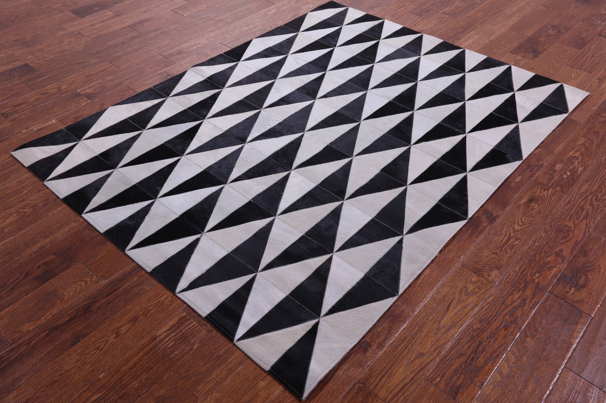 Black & White Natural Cowhide Hand Stitched Patchwork Rug - 4' 11" X 6' 5" - Golden Nile