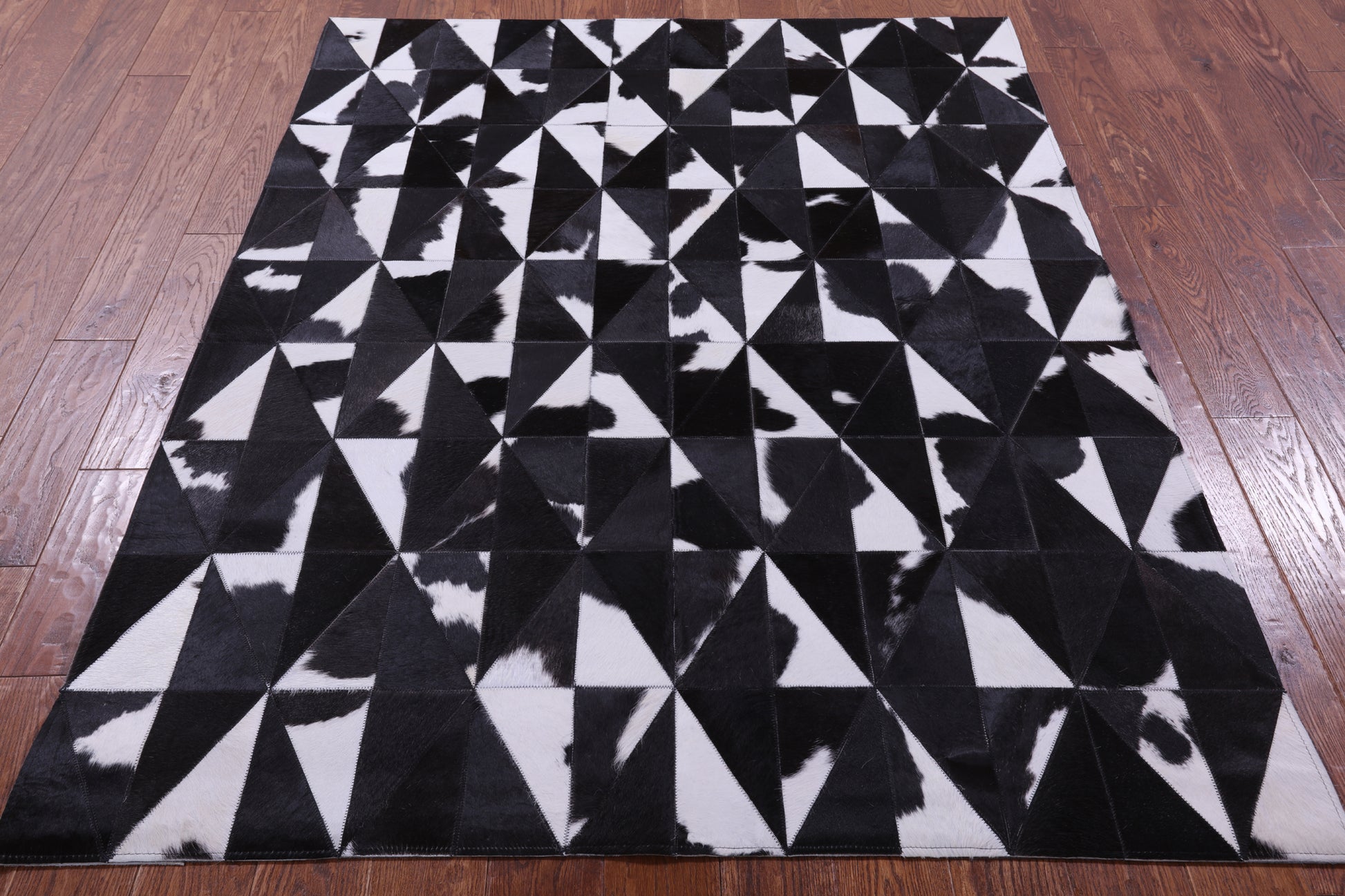 Black & White Natural Cowhide Hand Stitched Patchwork Rug - 4' 11" X 6' 5" - Golden Nile