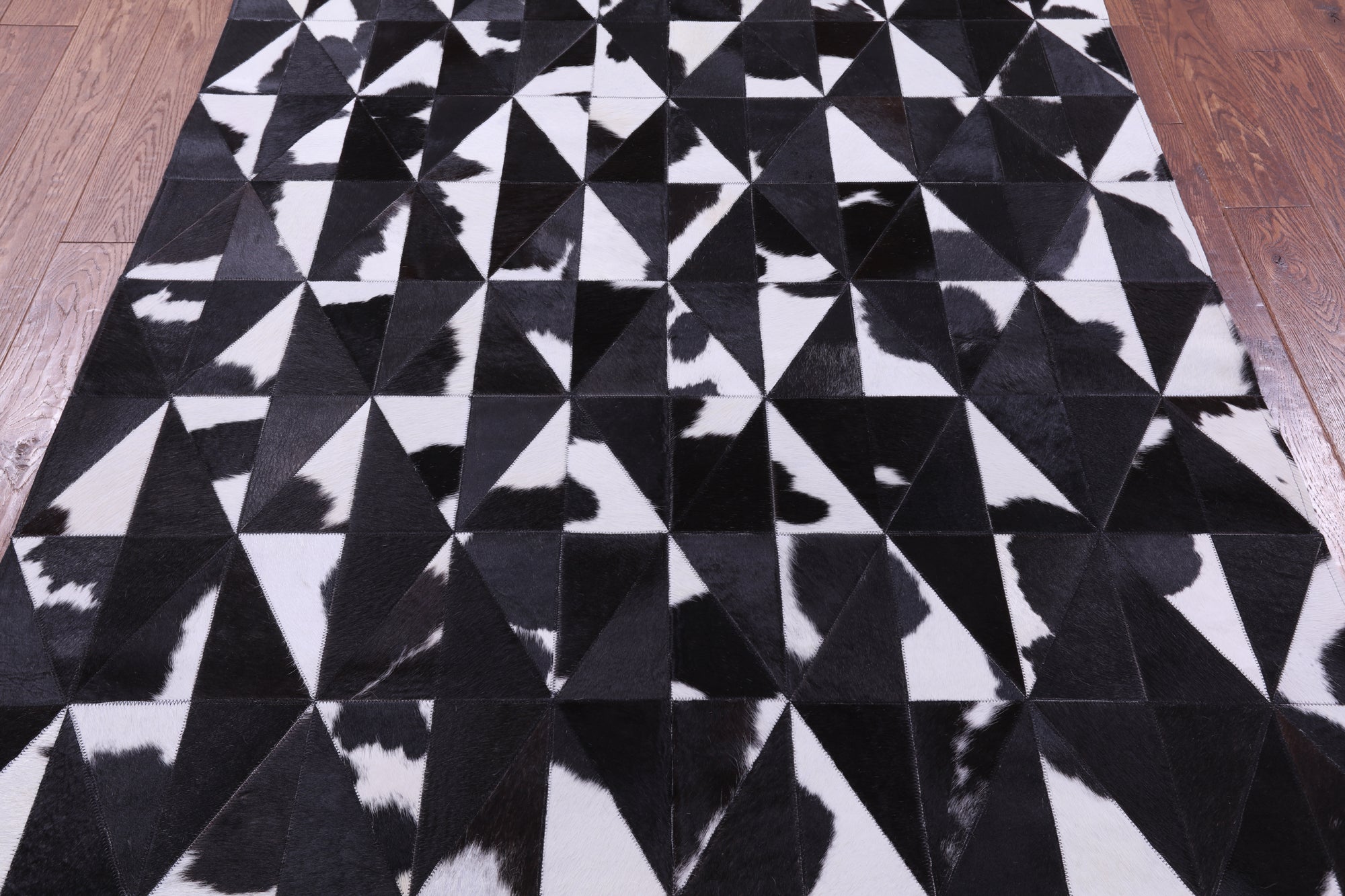 Black & White Natural Cowhide Hand Stitched Patchwork Rug - 4' 11" X 6' 5" - Golden Nile