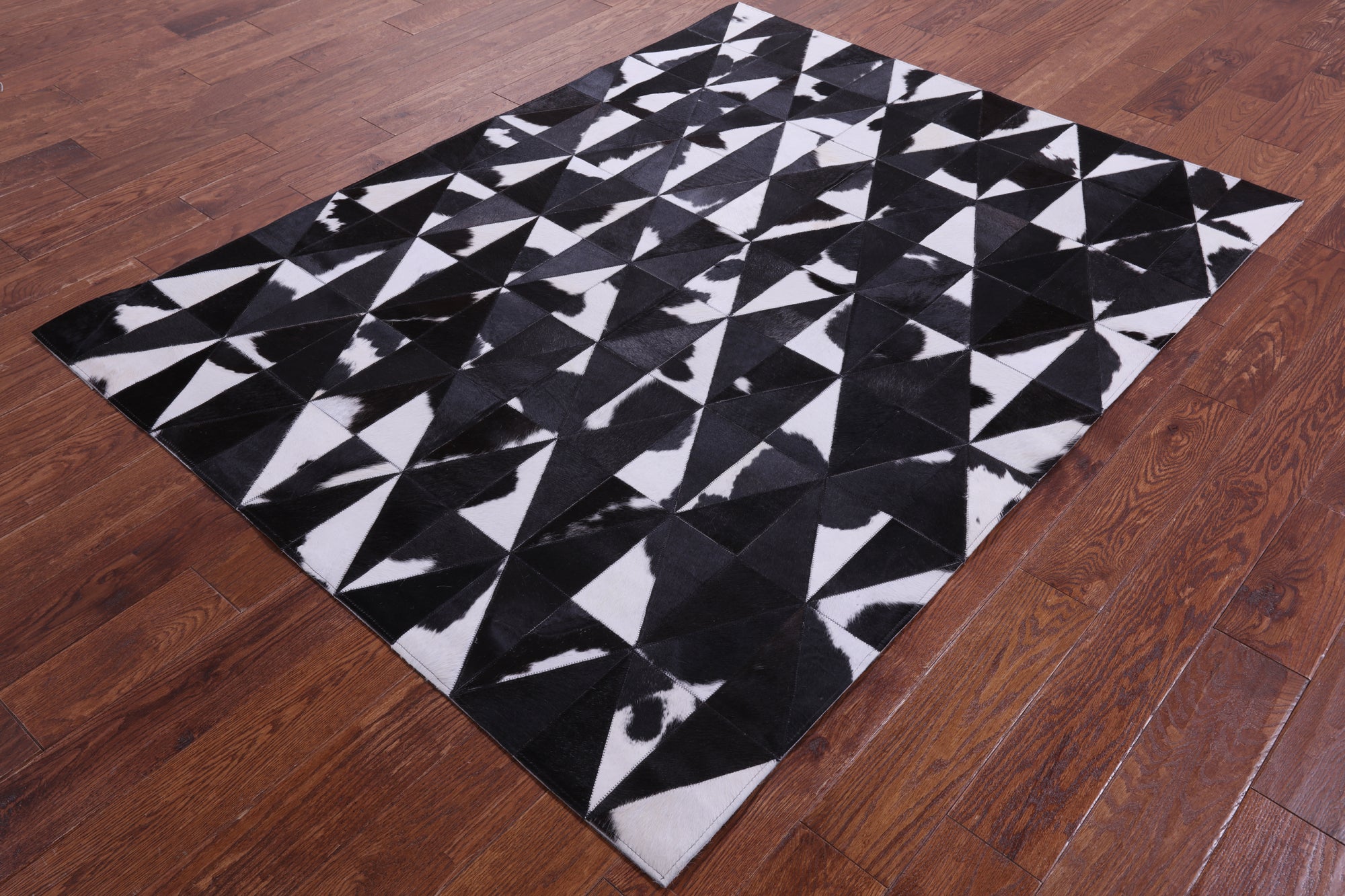Black & White Natural Cowhide Hand Stitched Patchwork Rug - 4' 11" X 6' 5" - Golden Nile