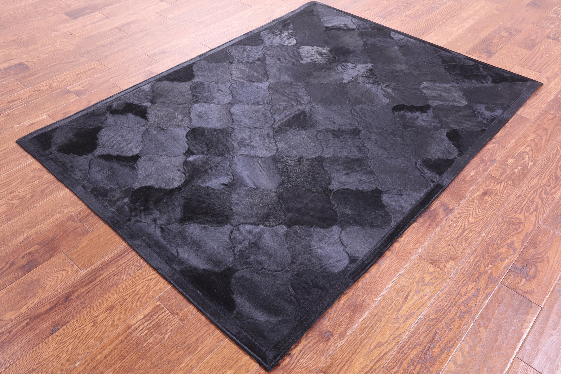 Lantern Tile Black Natural Cowhide Hand Stitched Patchwork Rug - 4' 10" X 6' 6" - Golden Nile