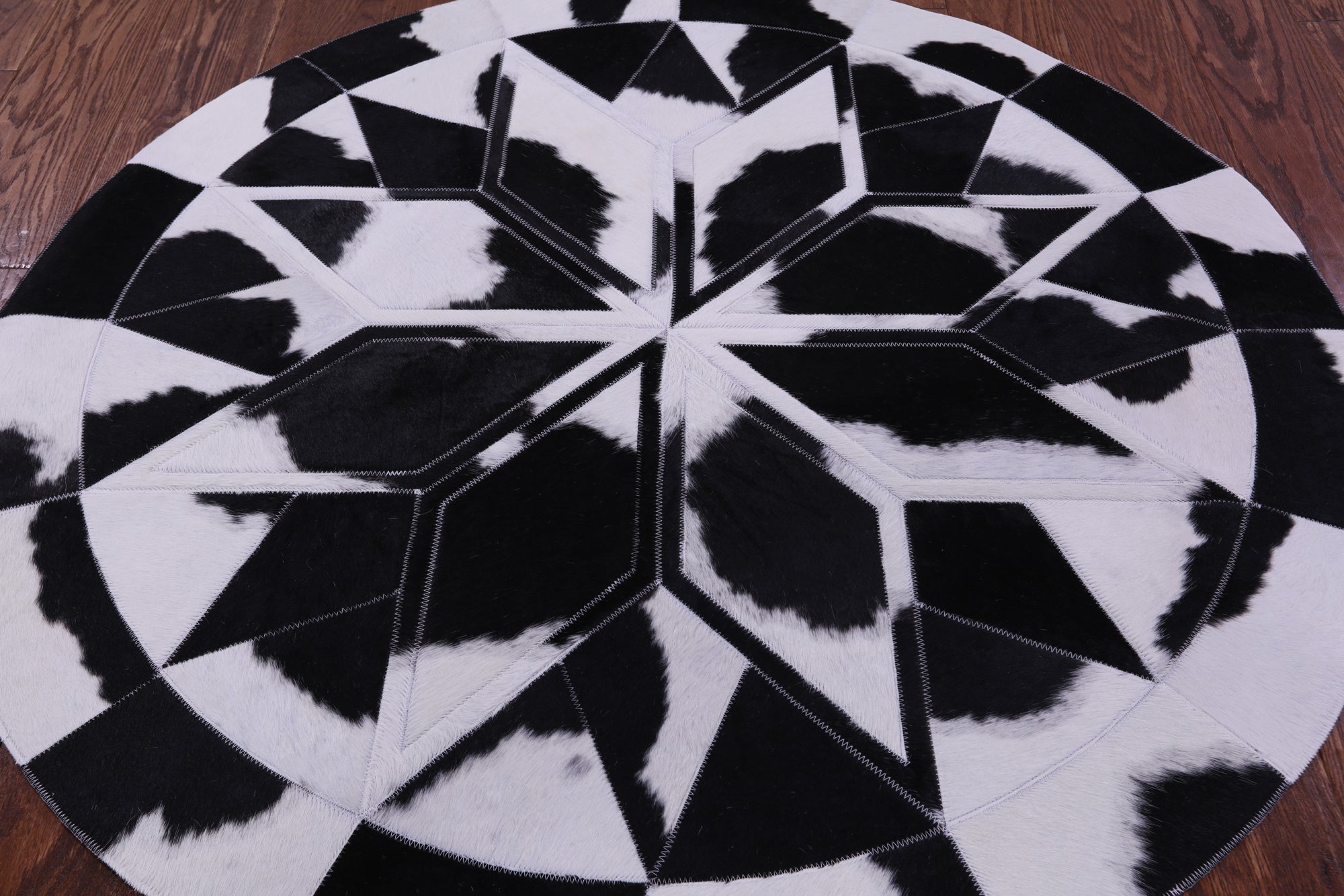Black & White Round Star Natural Cowhide Hand Stitched Patchwork Rug - 4' 0" X 4' 0" - Golden Nile