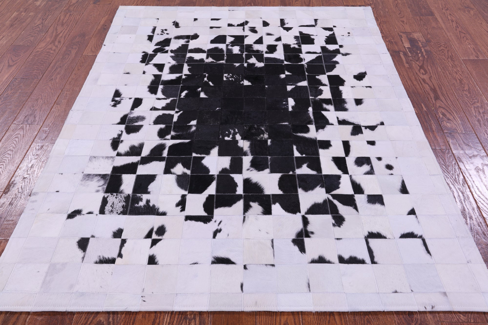 Black & White Natural Cowhide Hand Stitched Patchwork Rug - 5' 0" X 6' 7"