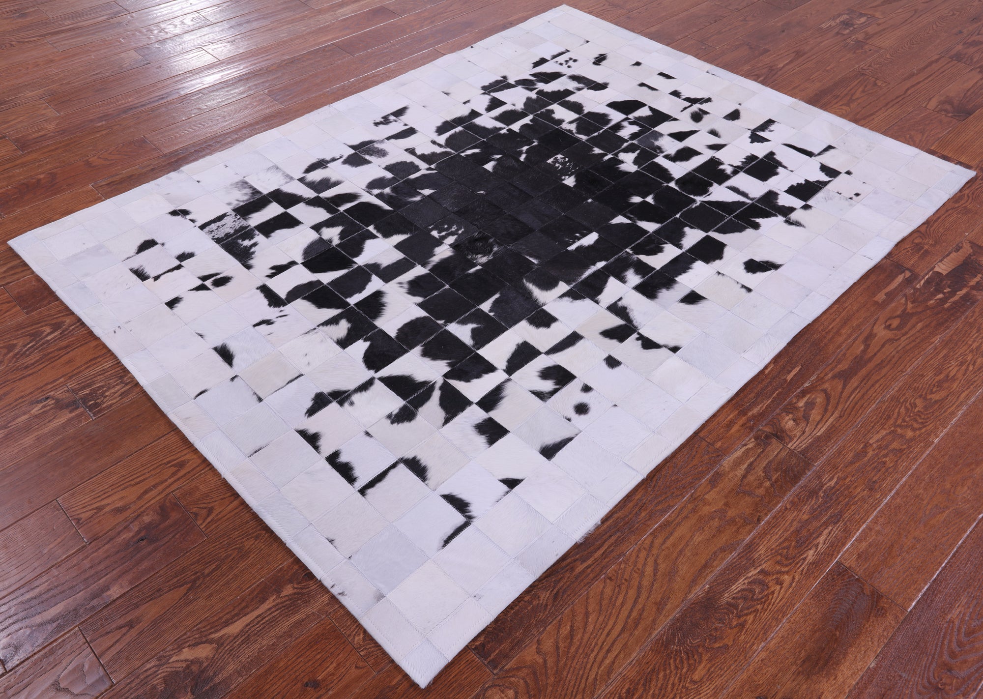 Black & White Natural Cowhide Hand Stitched Patchwork Rug - 5' 0" X 6' 7"
