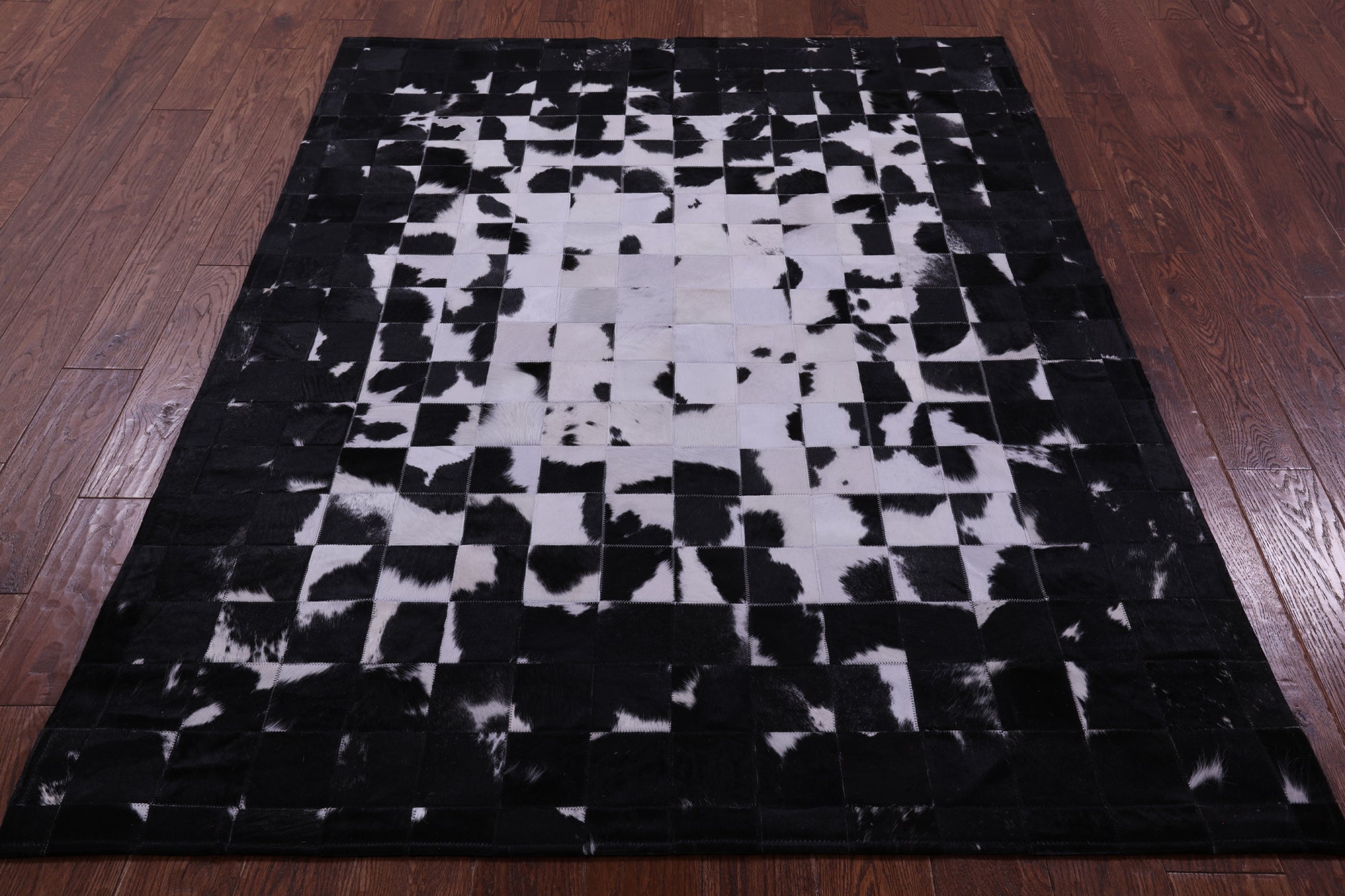 Black & White Natural Cowhide Hand Stitched Patchwork Rug - 5' 0" X 6' 7"