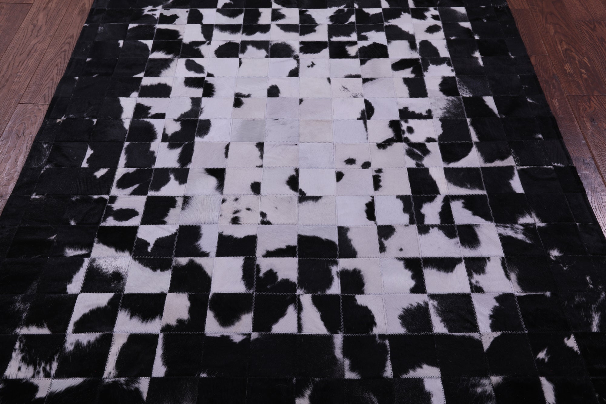 Black & White Natural Cowhide Hand Stitched Patchwork Rug - 5' 0" X 6' 7"
