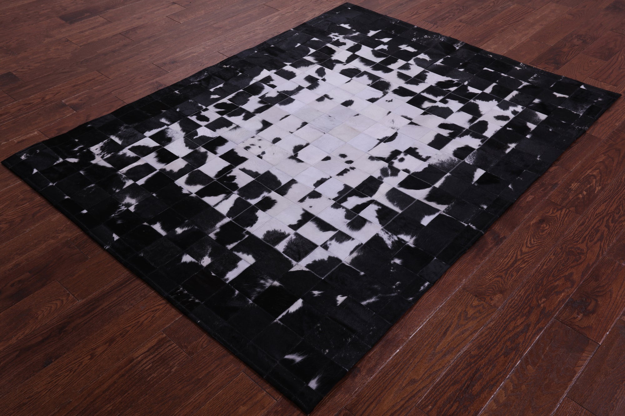 Black & White Natural Cowhide Hand Stitched Patchwork Rug - 5' 0" X 6' 7"