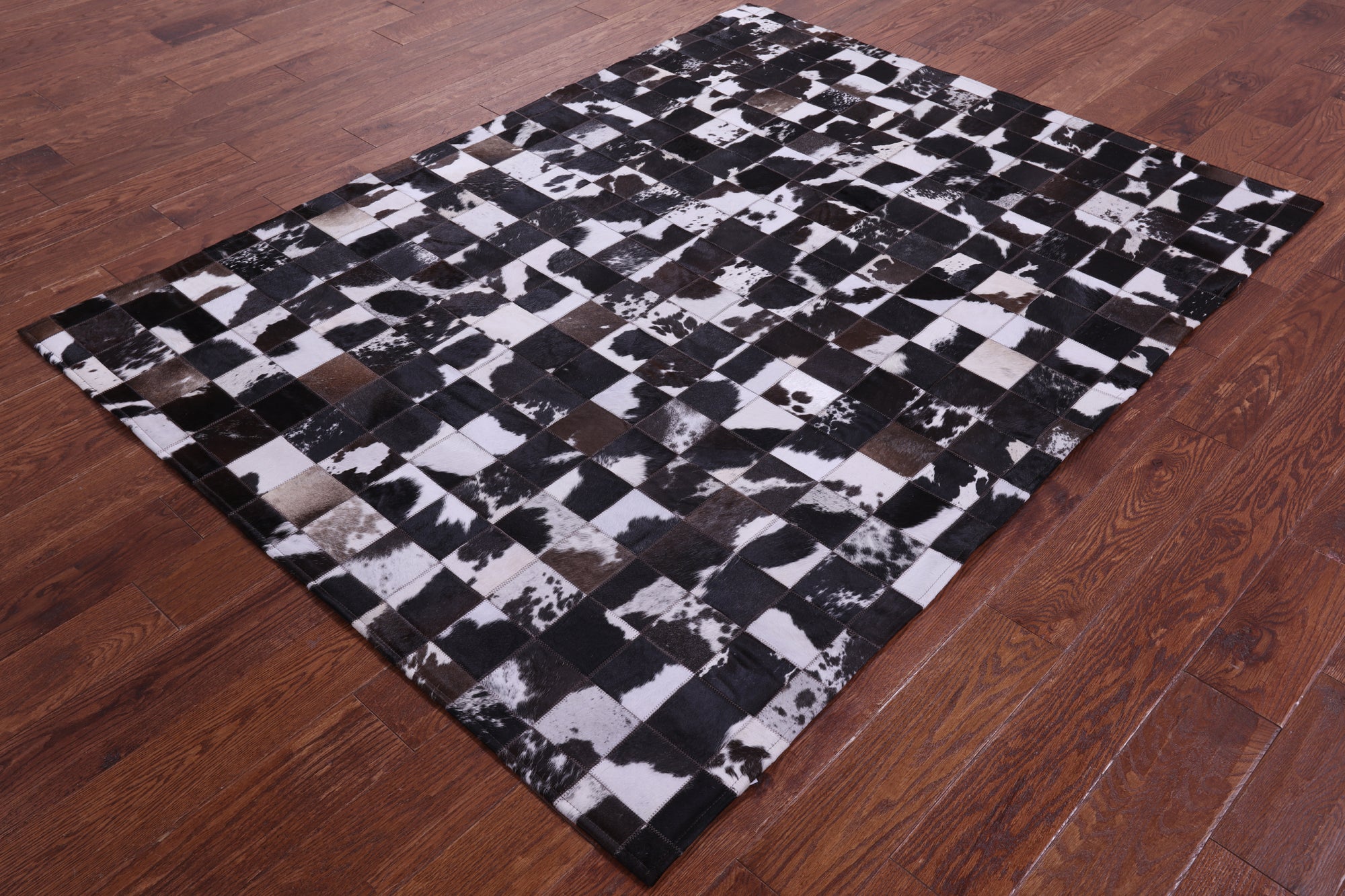Brown & White Natural Cowhide Hand Stitched Patchwork Rug - 5' 0" X 6' 7"