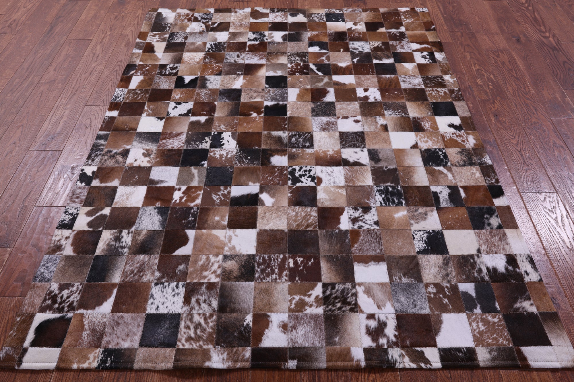 Brown & White Natural Cowhide Hand Stitched Patchwork Rug - 5' 0" X 6' 7"