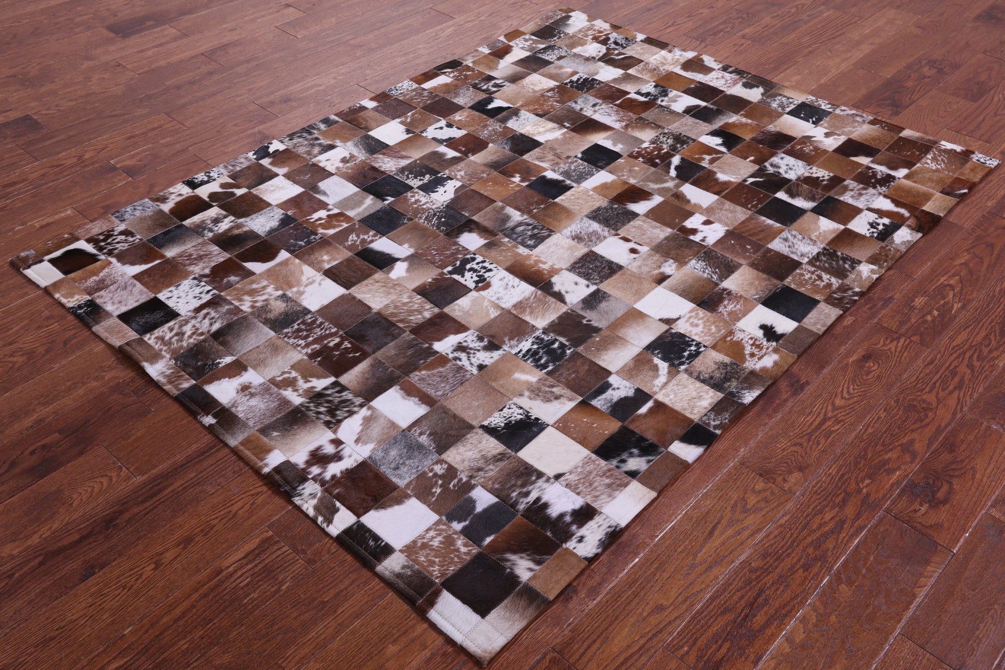 Brown & White Natural Cowhide Hand Stitched Patchwork Rug - 5' 0" X 6' 7"