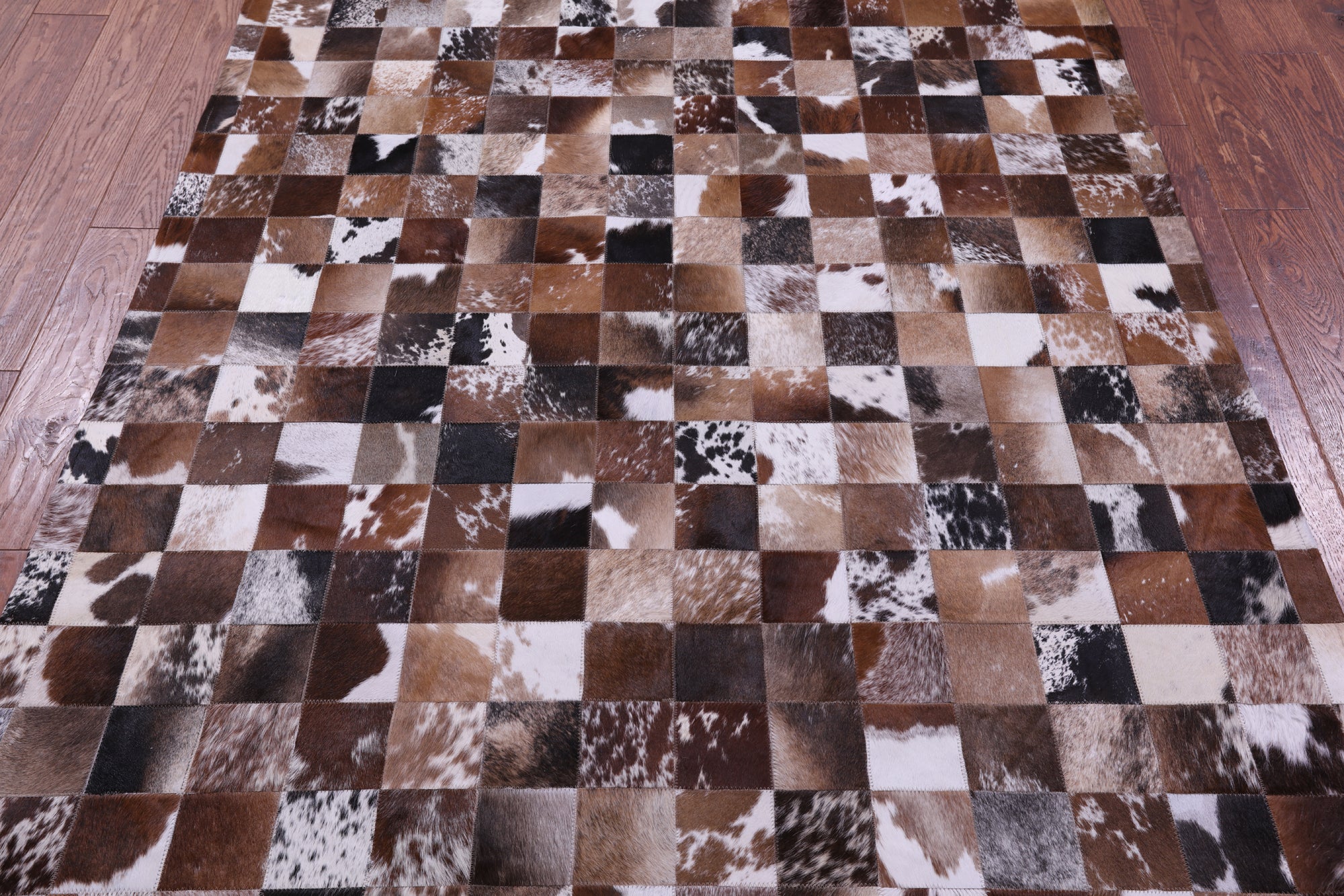 Brown & White Natural Cowhide Hand Stitched Patchwork Rug - 5' 0" X 6' 7"
