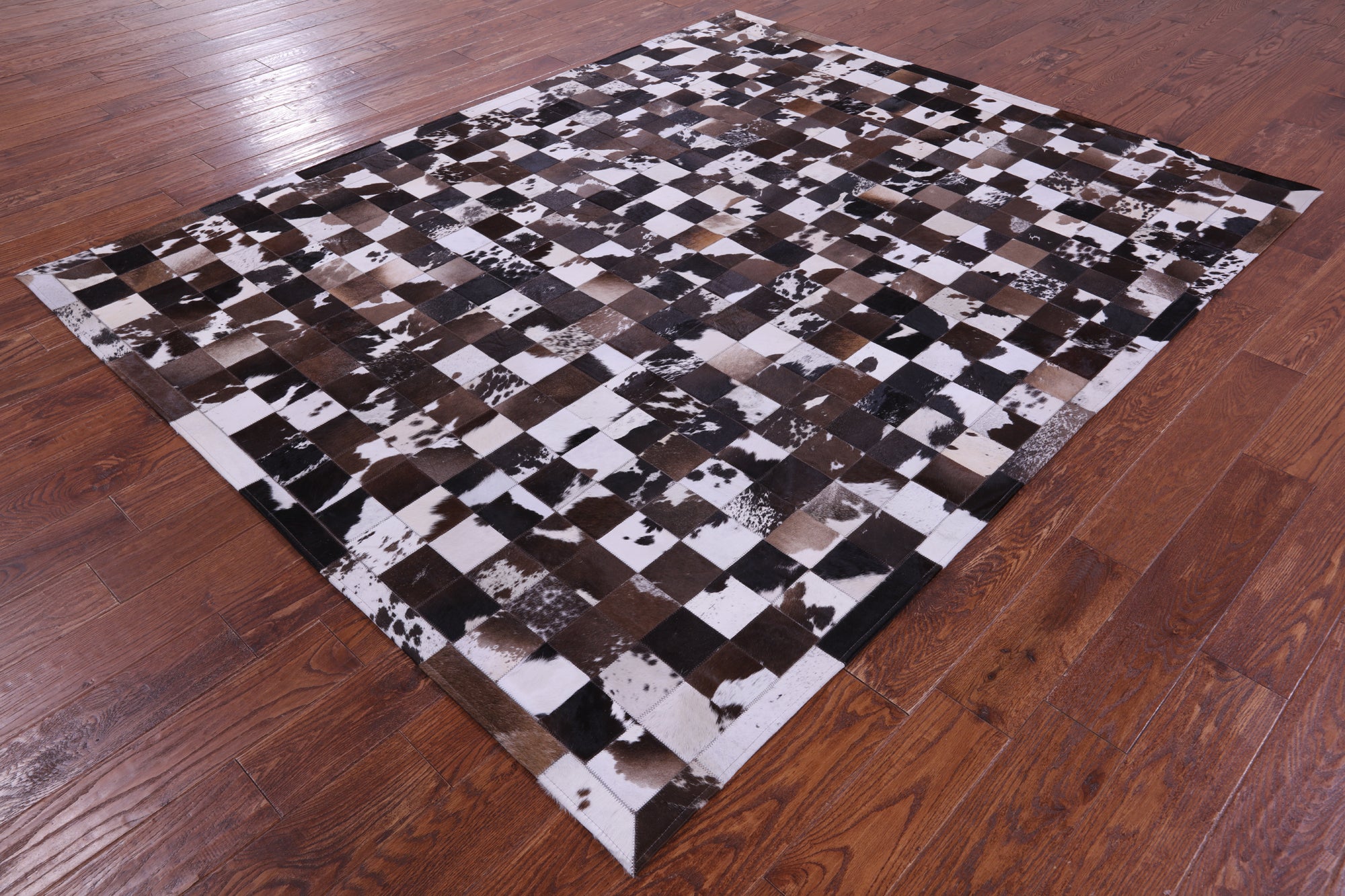 Brown & White Natural Cowhide Hand Stitched Patchwork Rug - 6' 7" X 8' 3"
