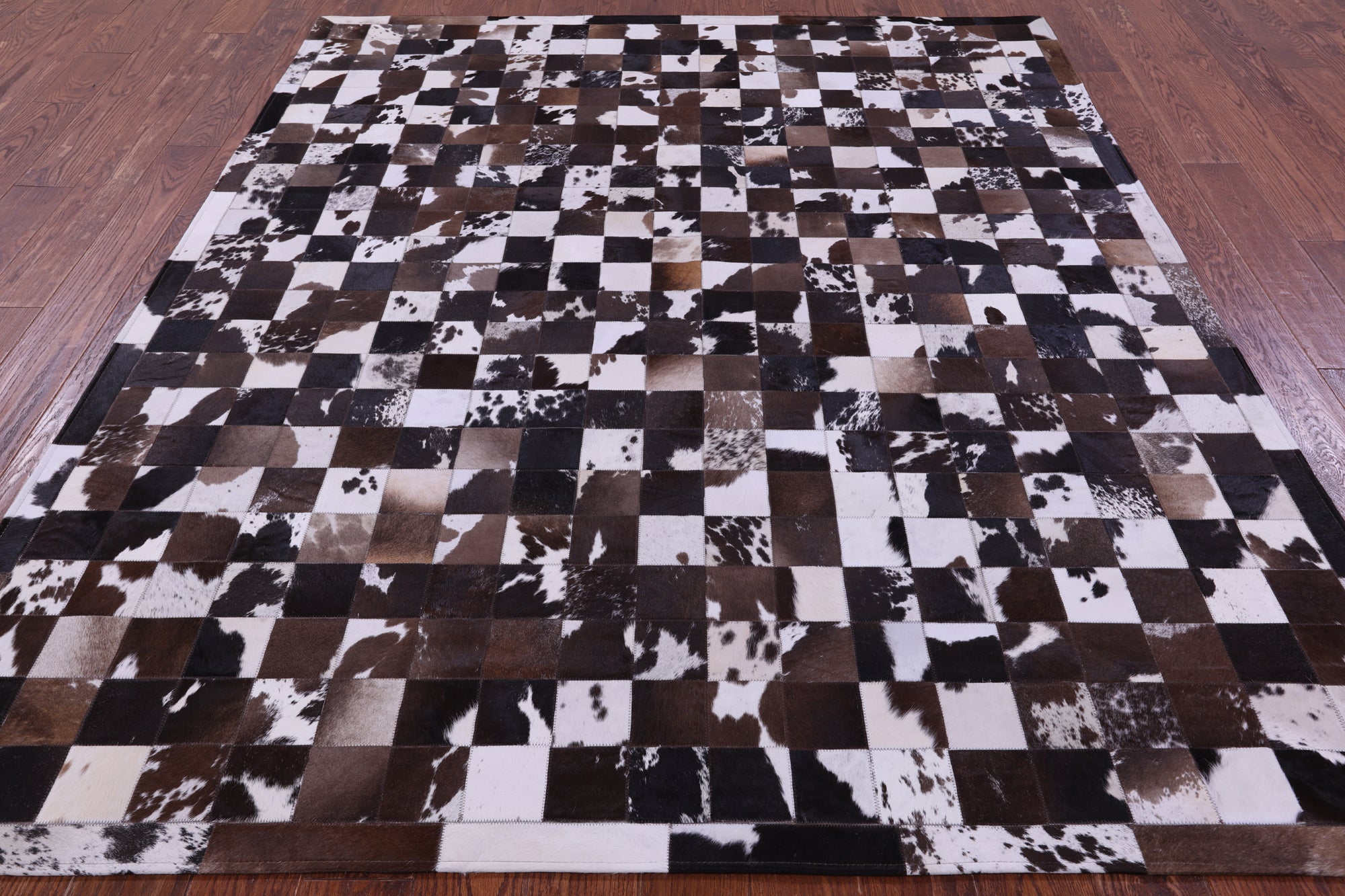 Brown & White Natural Cowhide Hand Stitched Patchwork Rug - 6' 7" X 8' 3"