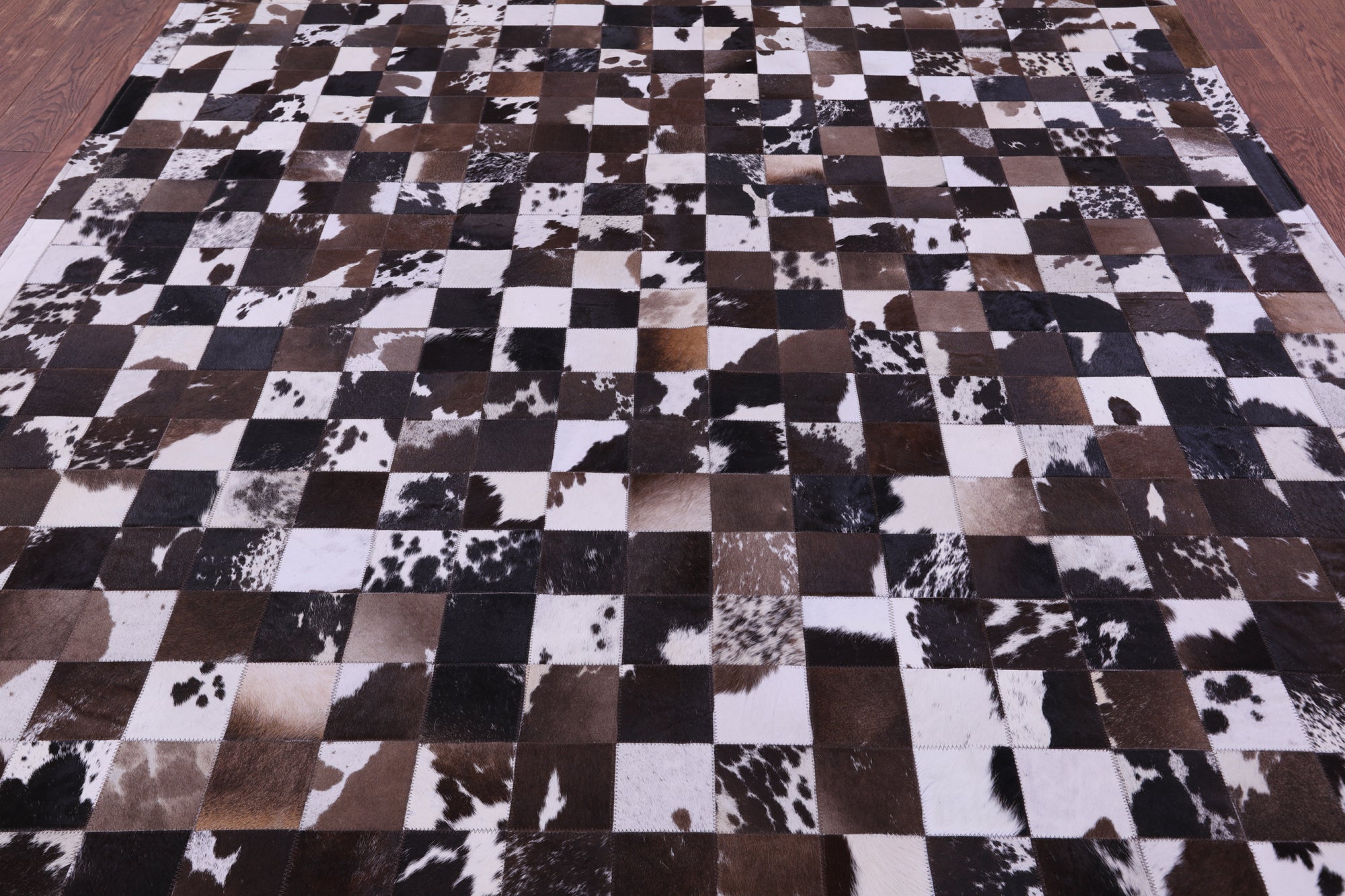 Brown & White Natural Cowhide Hand Stitched Patchwork Rug - 6' 7" X 8' 3"