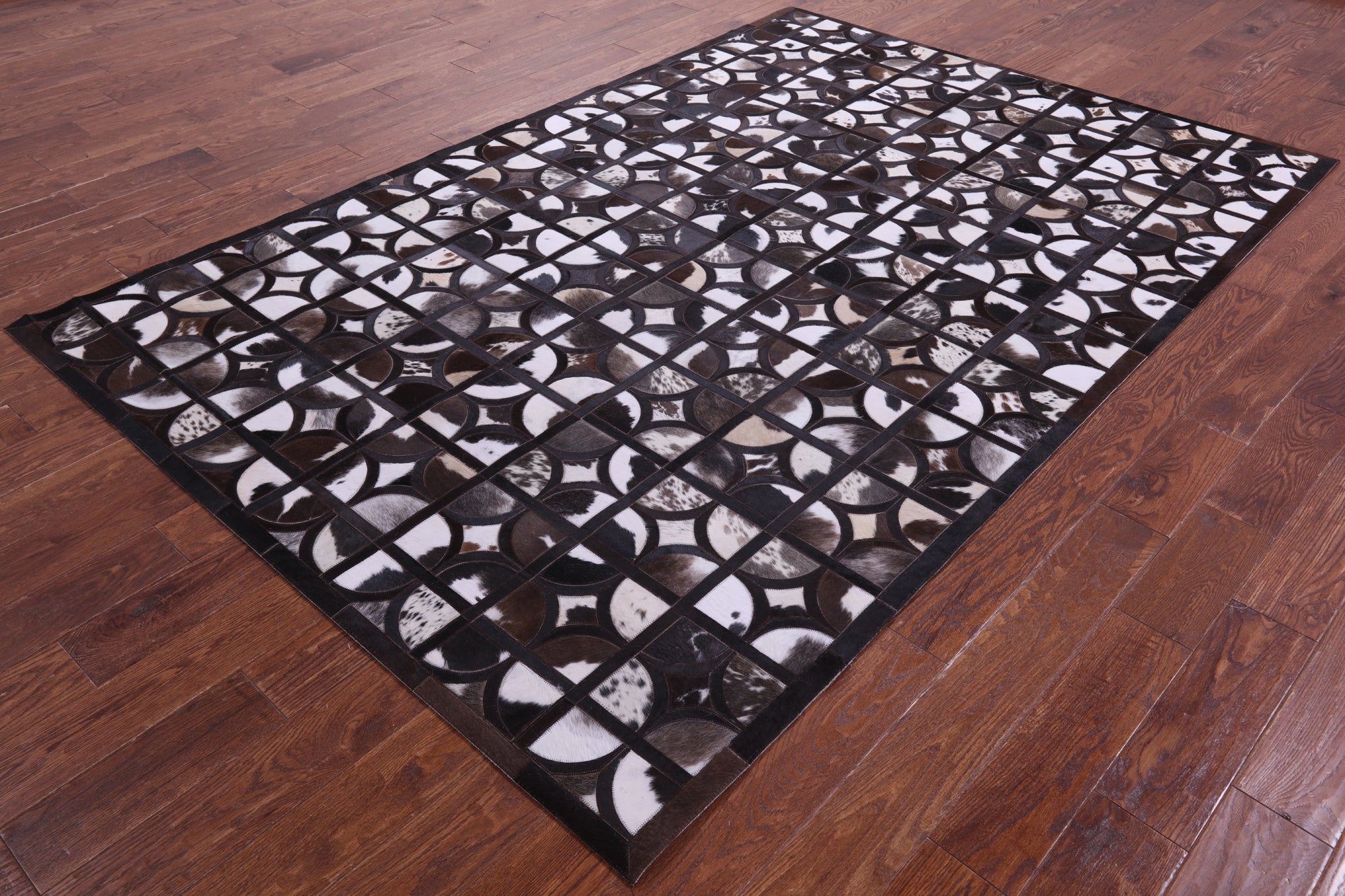 Brown & White Black Natural Cowhide Hand Stitched Patchwork Rug - 6' 0" X 9' 0"