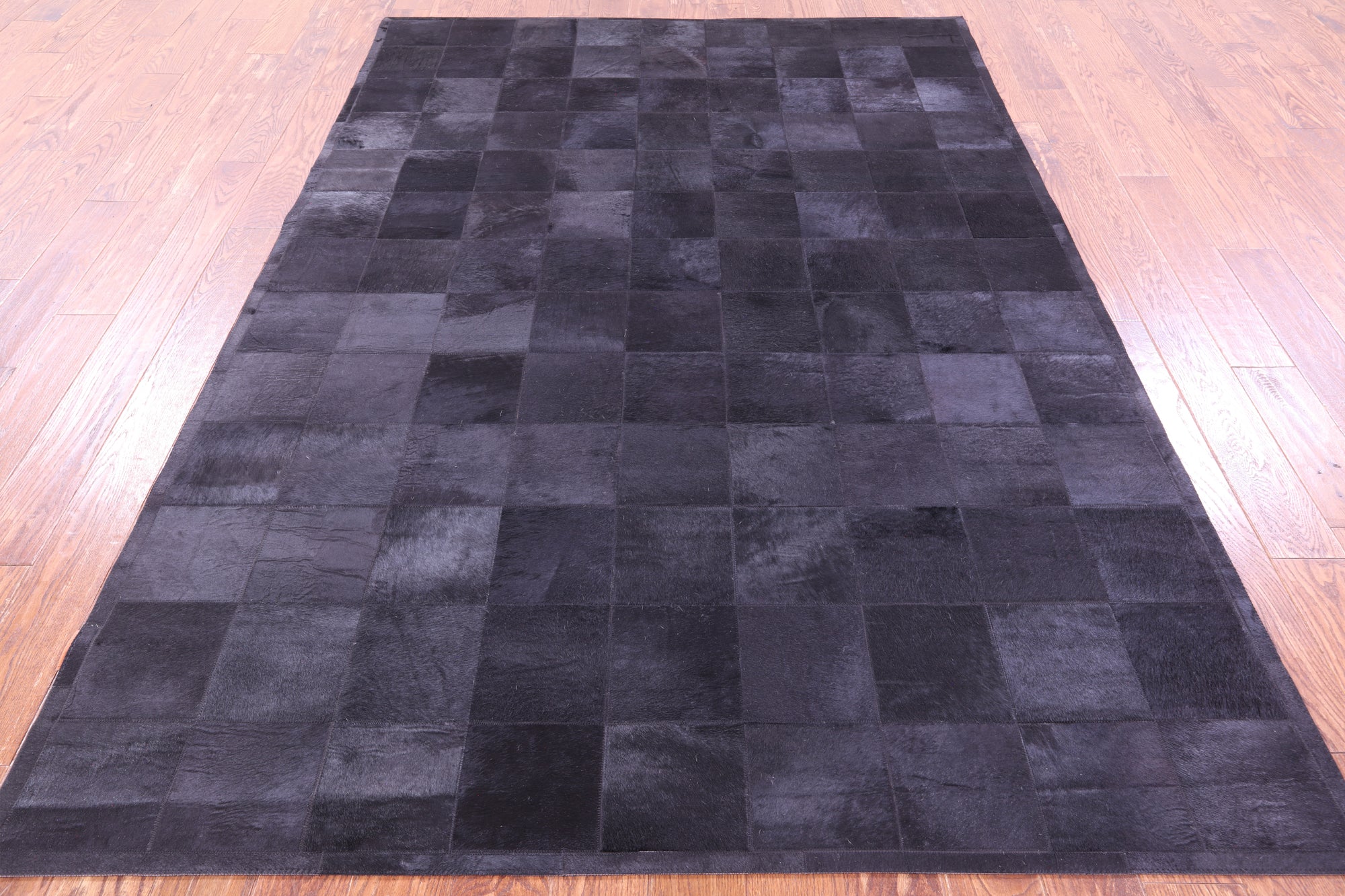 Black Natural Cowhide Hand Stitched Patchwork Rug - 6' 0" X 9' 0"