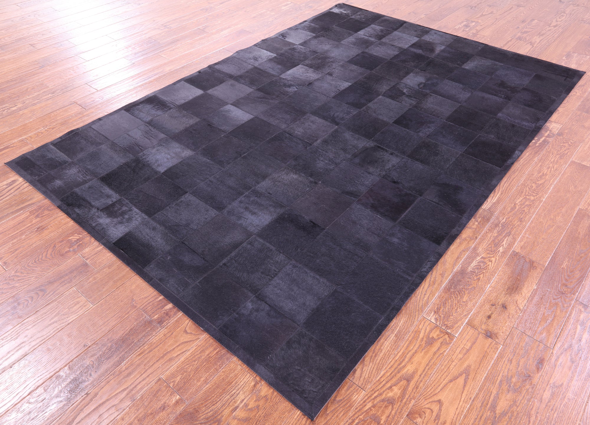 Black Natural Cowhide Hand Stitched Patchwork Rug - 6' 0" X 9' 0"