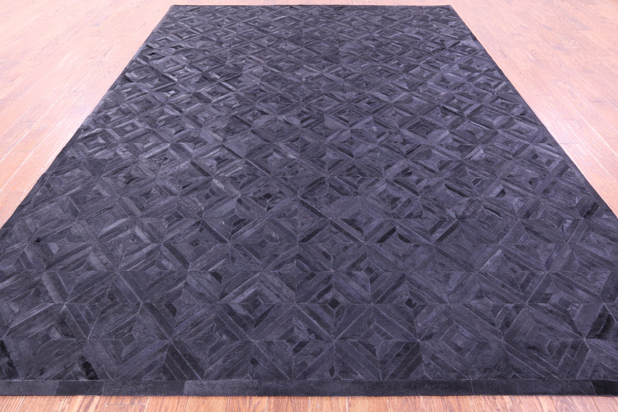 Black Natural Cowhide Hand Stitched Patchwork Rug - 9' 0" X 12' 0"