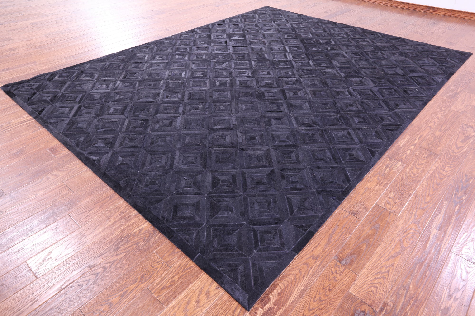 Black Natural Cowhide Hand Stitched Patchwork Rug - 9' 0" X 12' 0"