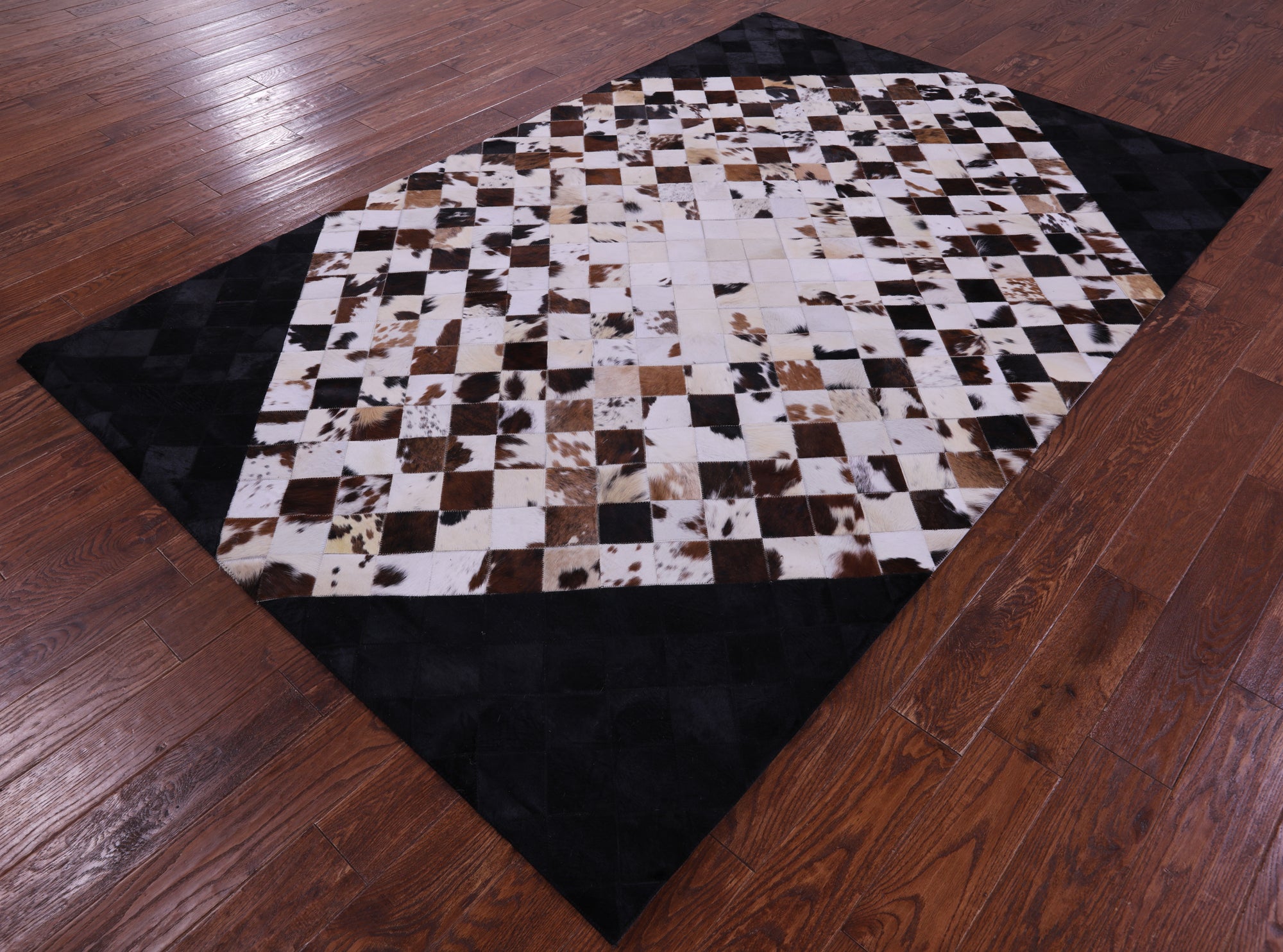 Brown & White & Black Natural Cowhide Hand Stitched Patchwork Rug - 6' 0" X 9' 0"