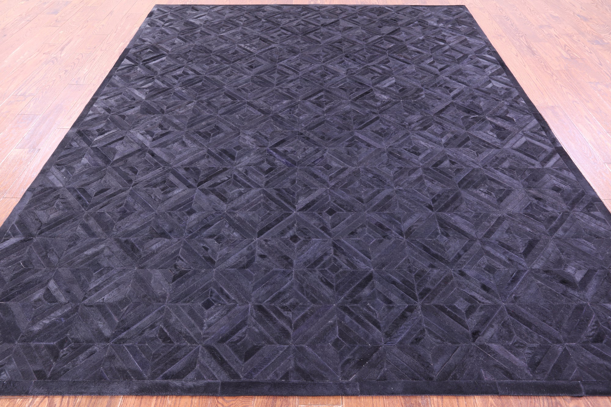 Black Natural Cowhide Hand Stitched Patchwork Rug - 8' 0" X 10' 0"
