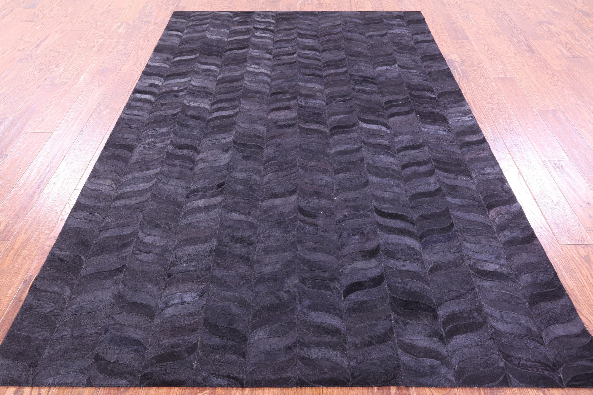 Black Natural Cowhide Hand Stitched Patchwork Rug - 6' 0" X 9' 0"