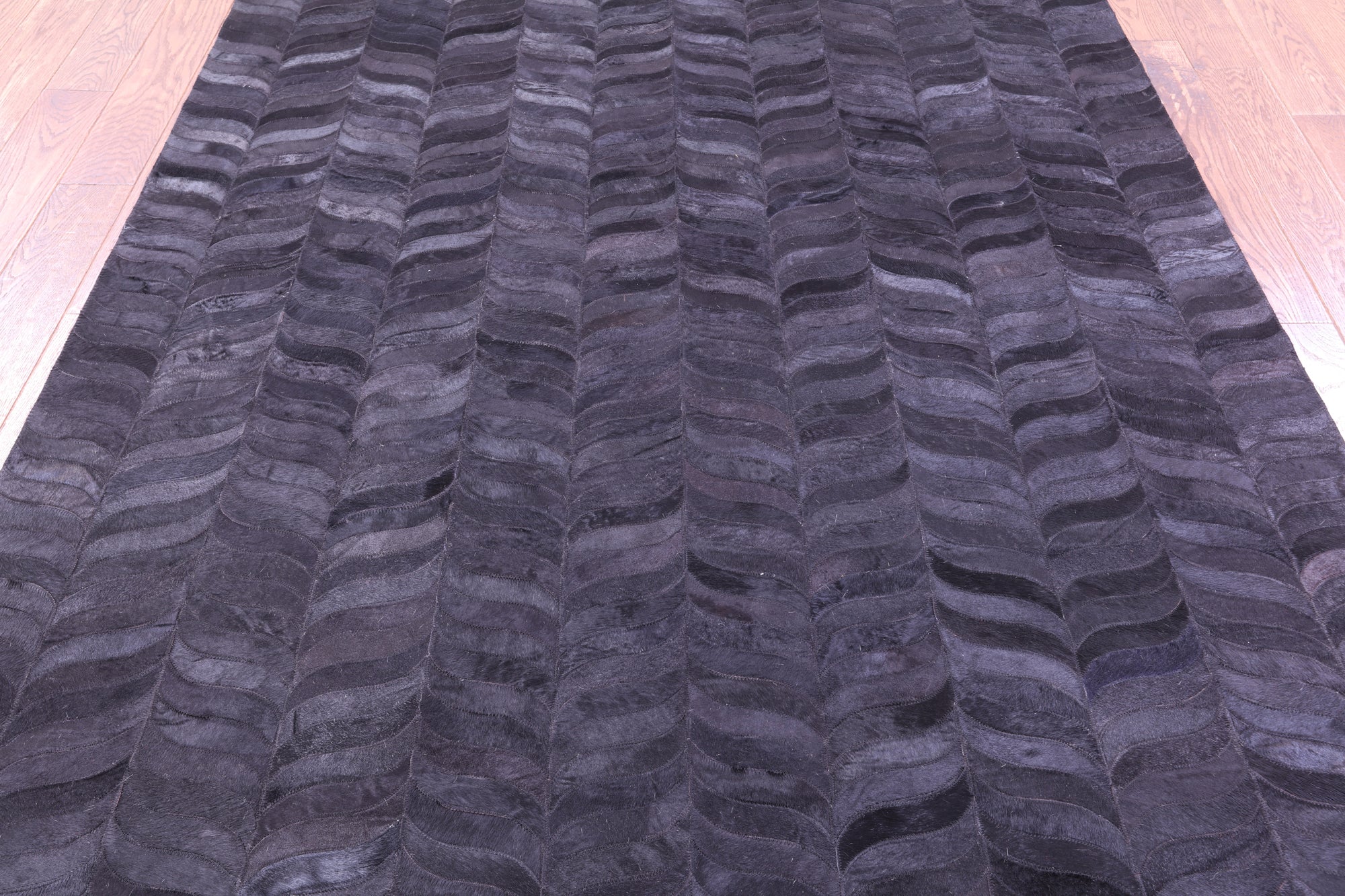 Black Natural Cowhide Hand Stitched Patchwork Rug - 6' 0" X 9' 0"