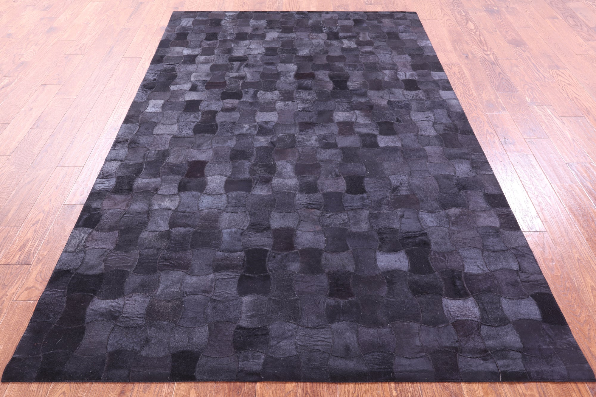 Black Natural Cowhide Hand Stitched Patchwork Rug - 6' 0" X 9' 0"