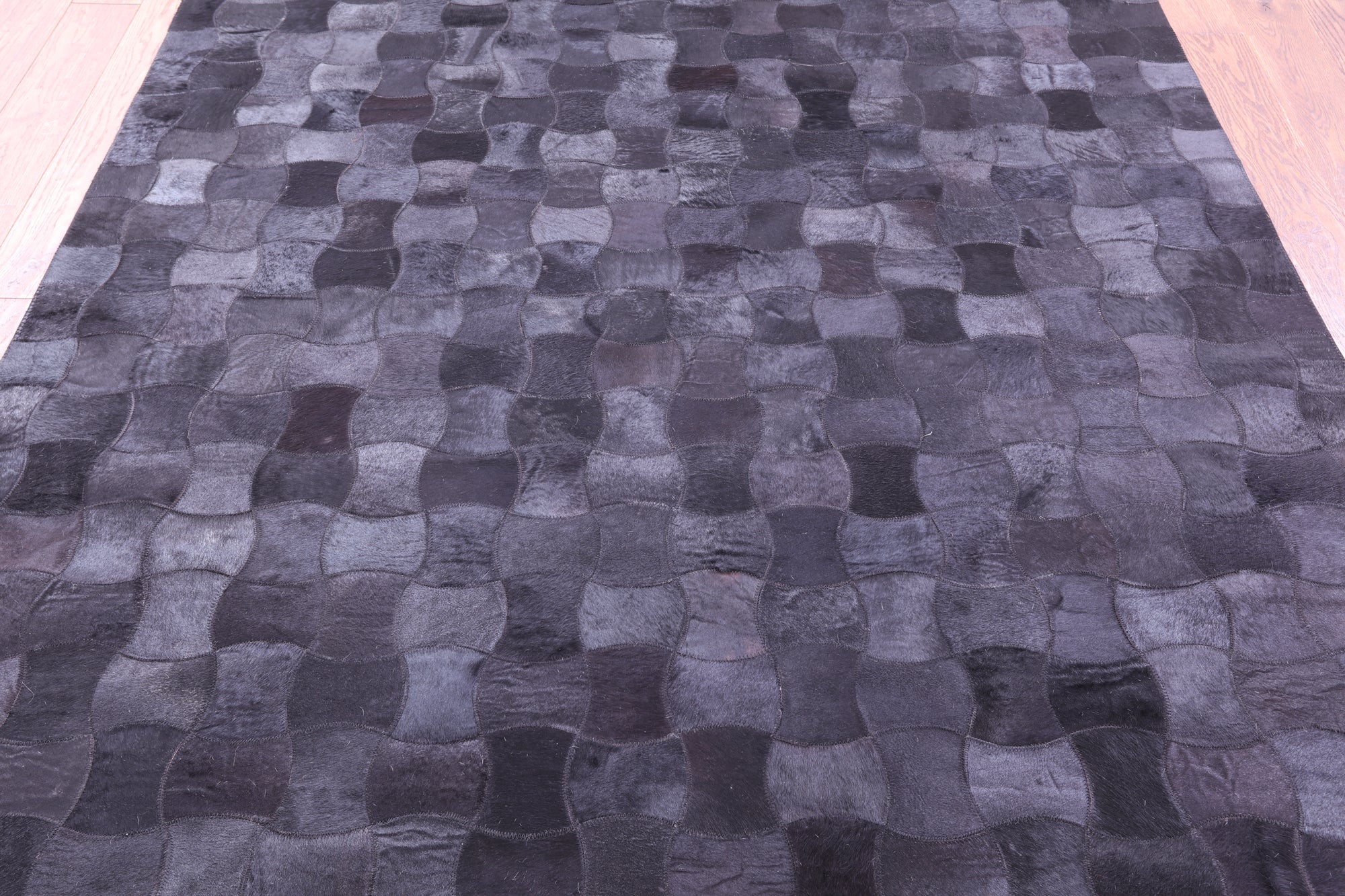 Black Natural Cowhide Hand Stitched Patchwork Rug - 6' 0" X 9' 0"