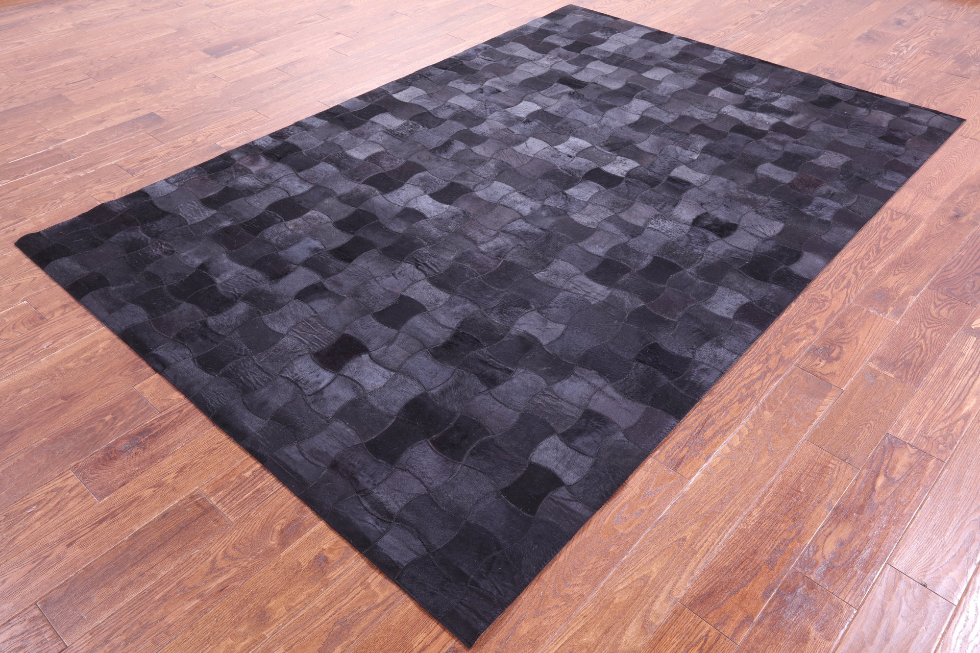 Black Natural Cowhide Hand Stitched Patchwork Rug - 6' 0" X 9' 0"