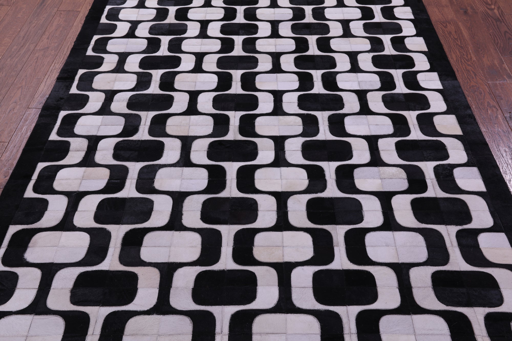 Black & White Natural Cowhide Hand Stitched Patchwork Rug - 6' 0" X 9' 0"