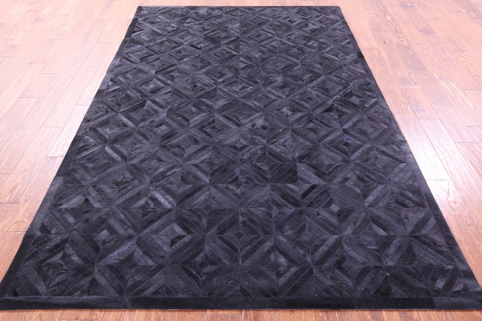 Black Natural Cowhide Hand Stitched Patchwork Rug - 6' 0" X 9' 0"
