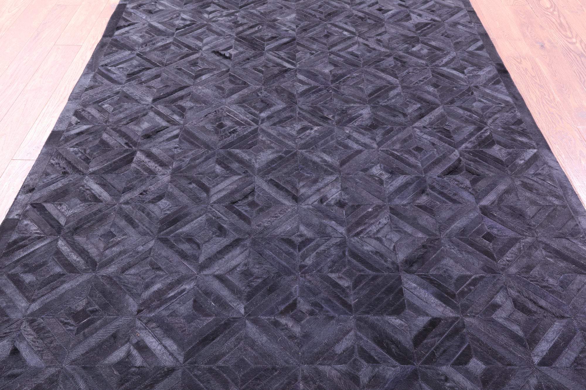 Black Natural Cowhide Hand Stitched Patchwork Rug - 6' 0" X 9' 0"