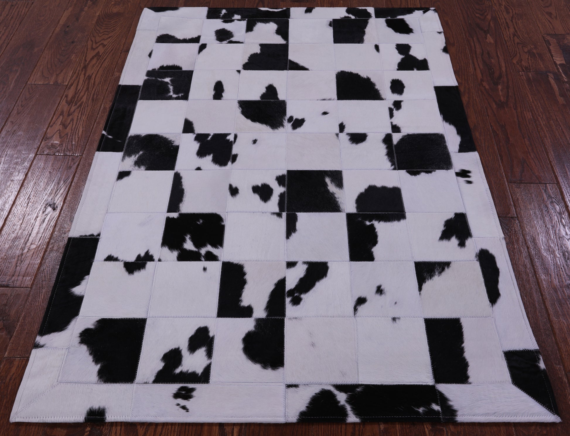 Black & White Natural Cowhide Hand Stitched Patchwork Rug - 3' 5" X 5' 0" - Golden Nile