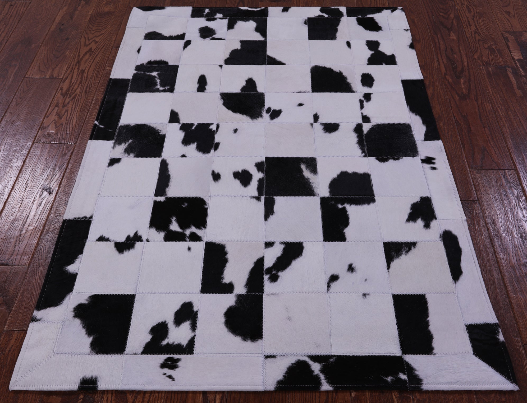 Black & White Natural Cowhide Hand Stitched Patchwork Rug - 3' 5" X 5' 0" - Golden Nile