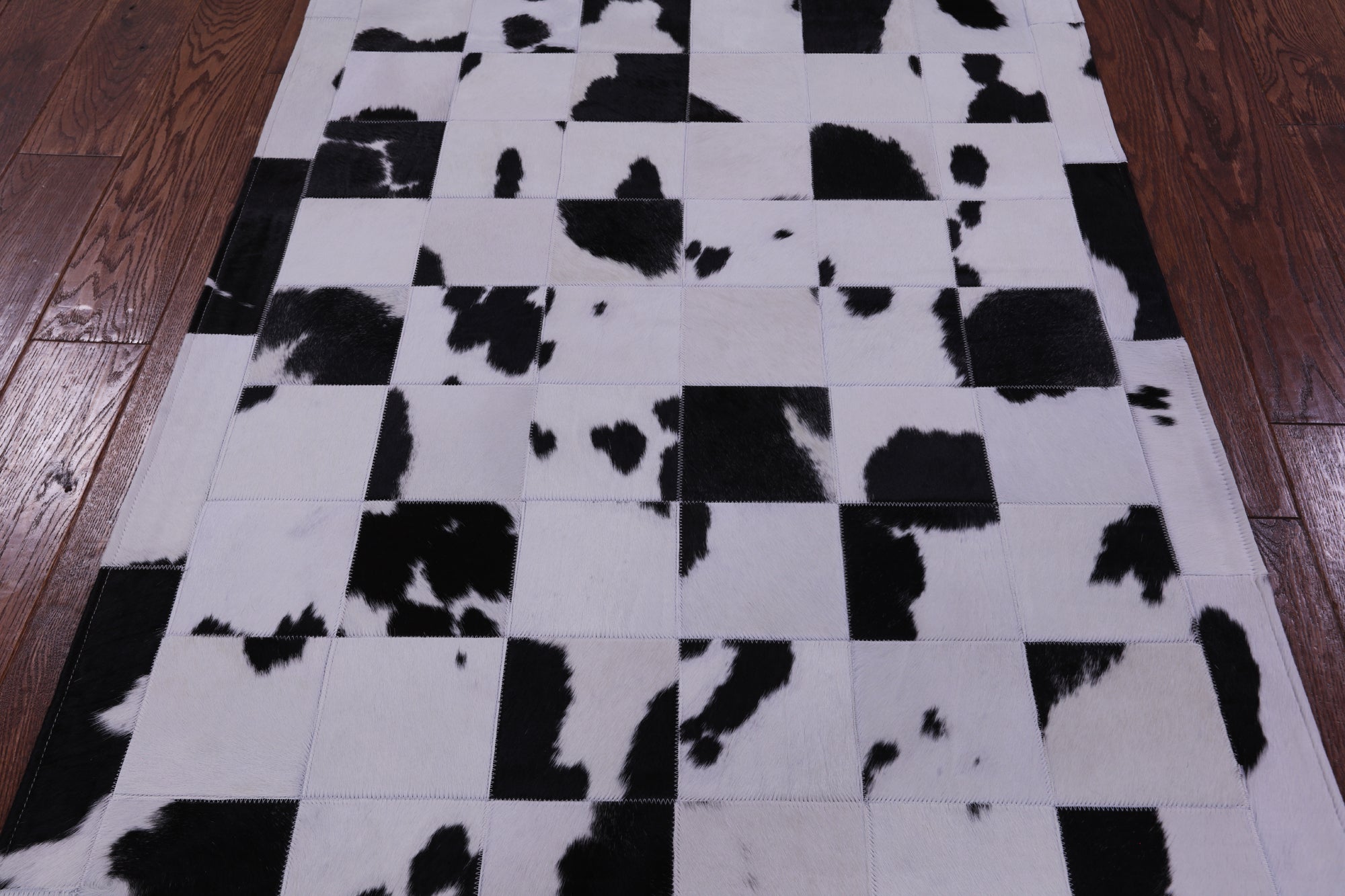 Black & White Natural Cowhide Hand Stitched Patchwork Rug - 3' 5" X 5' 0" - Golden Nile