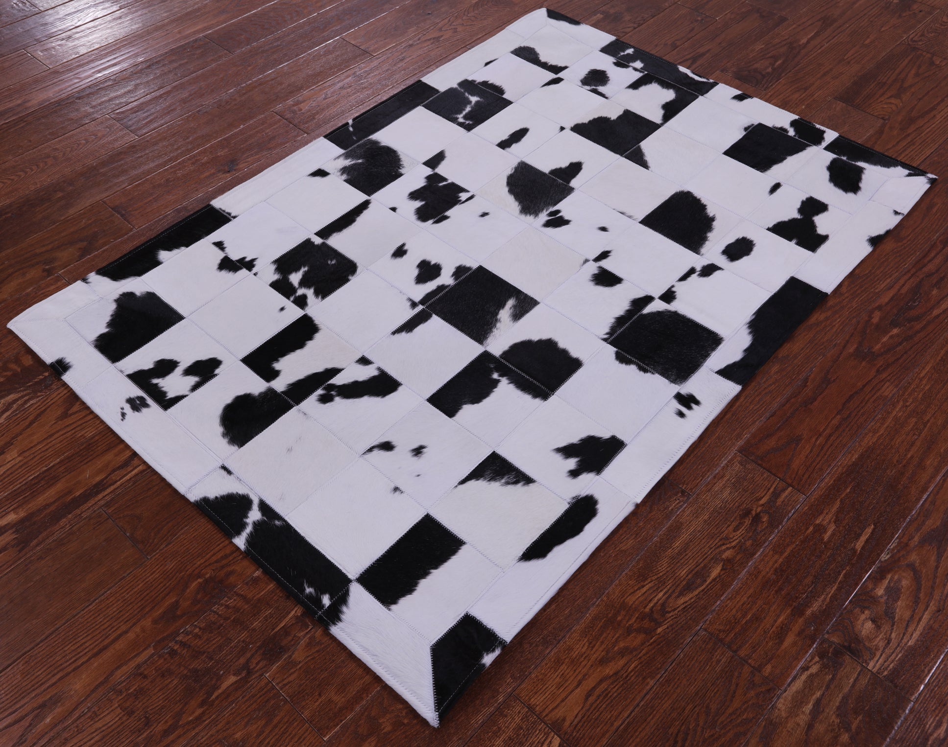 Black & White Natural Cowhide Hand Stitched Patchwork Rug - 3' 5" X 5' 0" - Golden Nile