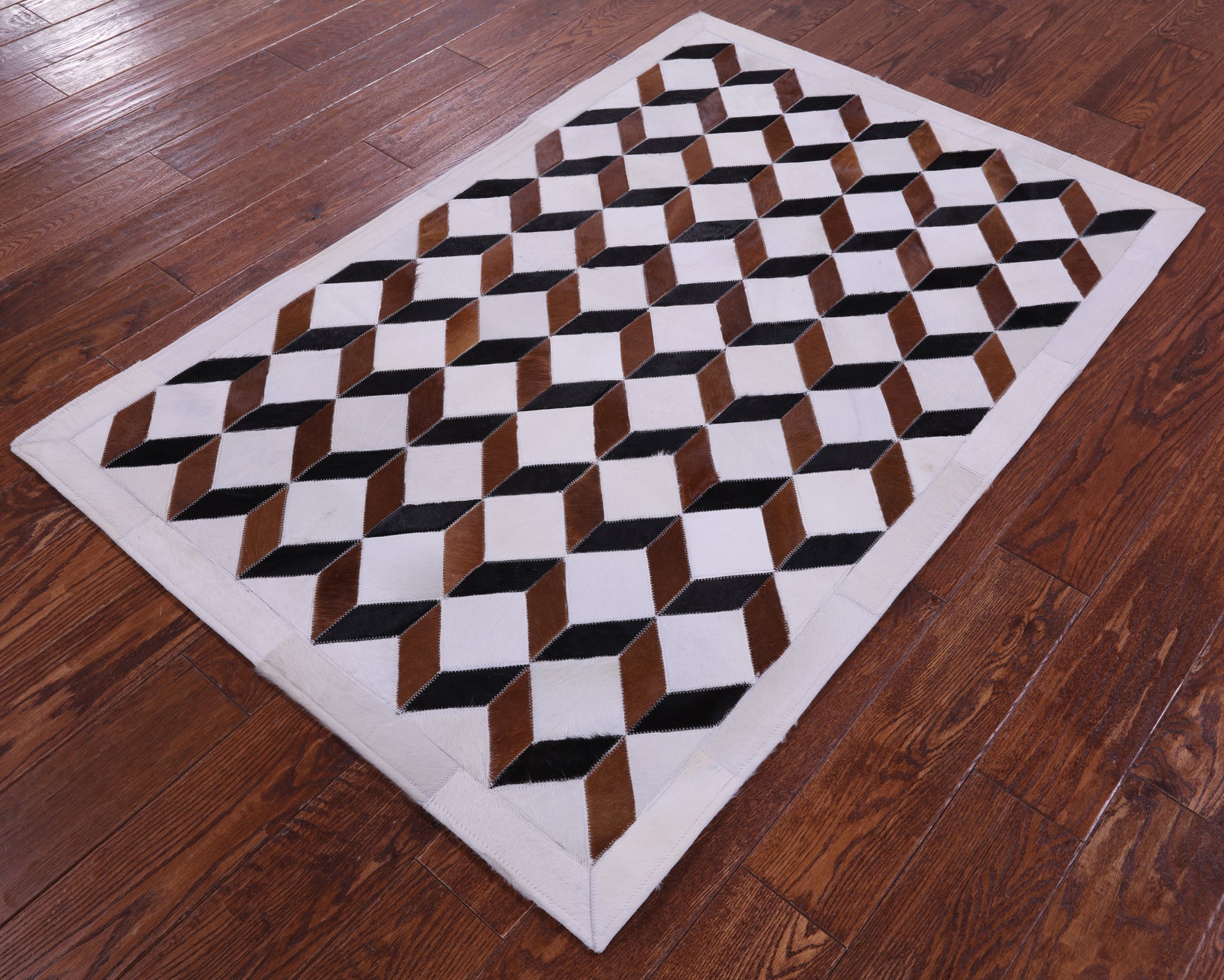 Brown & White Natural Black Cowhide Hand Stitched Patchwork Rug - 3' 5" X 5' 0" - Golden Nile