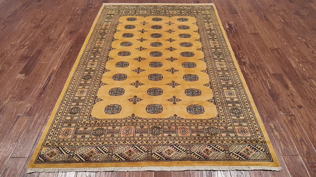 Load video: Gold Bokhara Hand Knotted Wool Rug - 5' 8" X 8' 0"