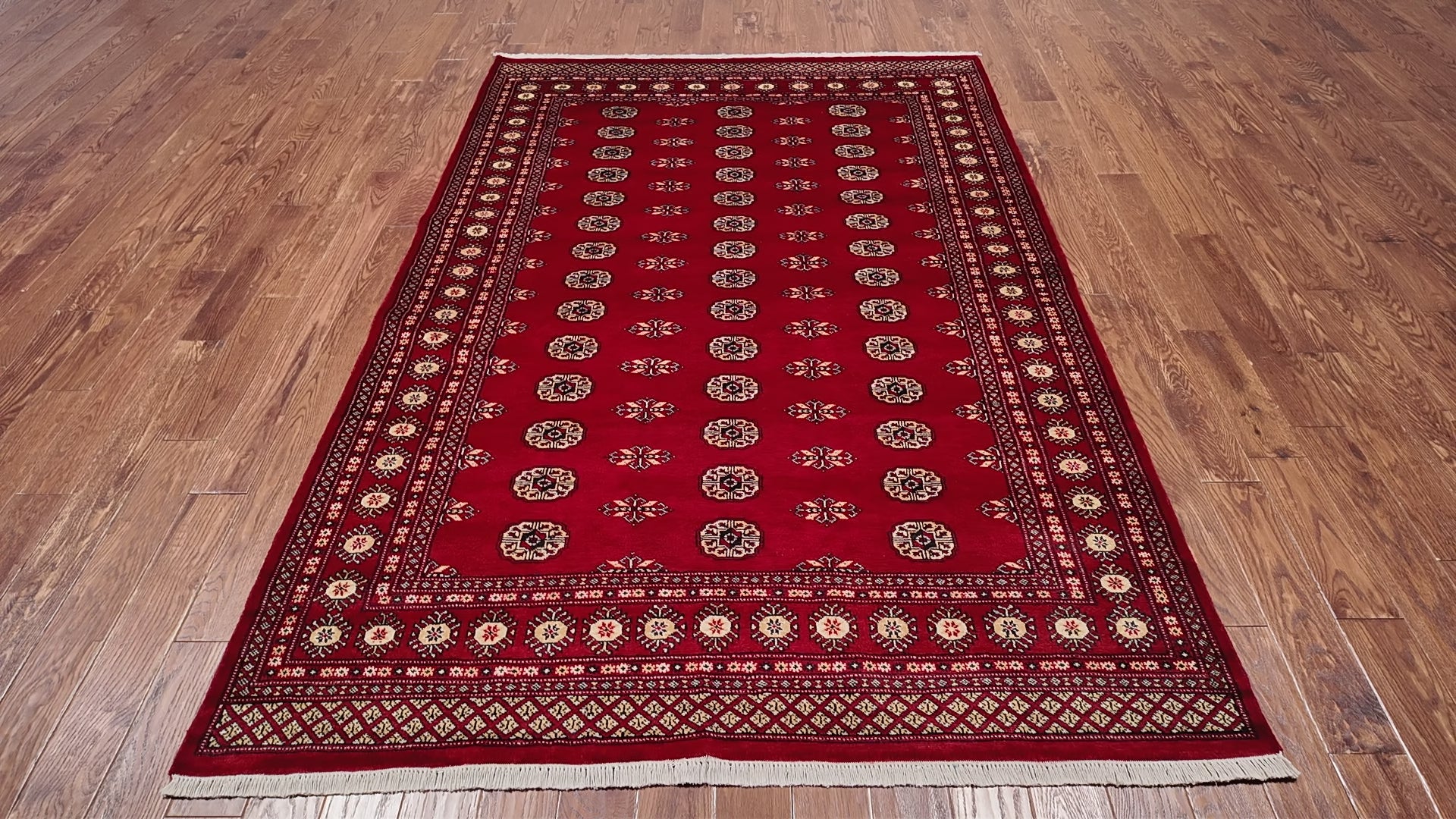 Load video: Red Bokhara Hand-Knotted Wool Rug - 6' 1" X 8' 9"